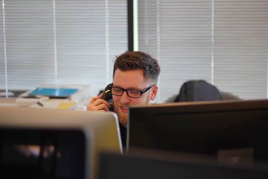 Office worker making outreach calls