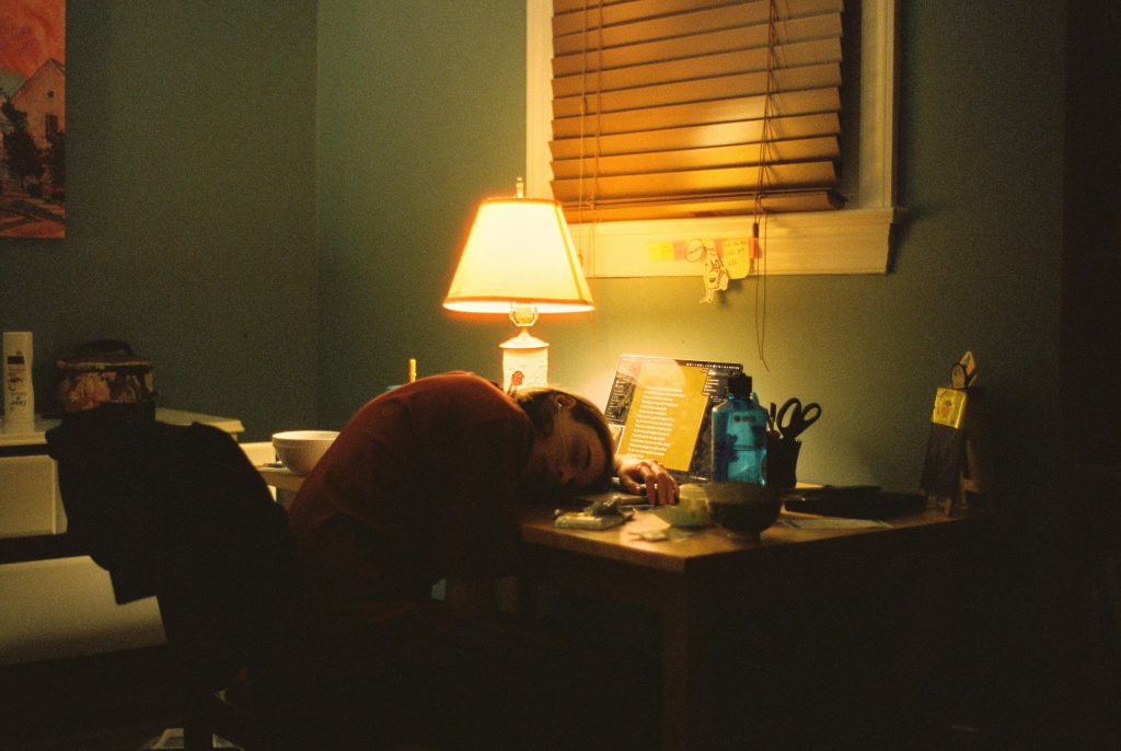 Overworked worker asleep at a desk
